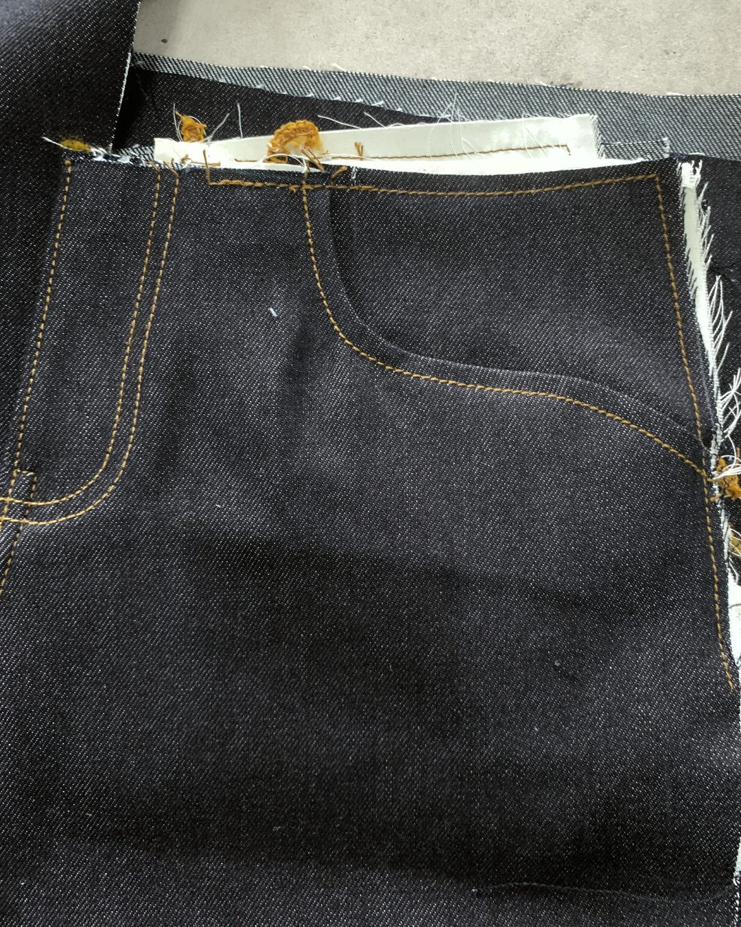 Interior pocket construction and stitching